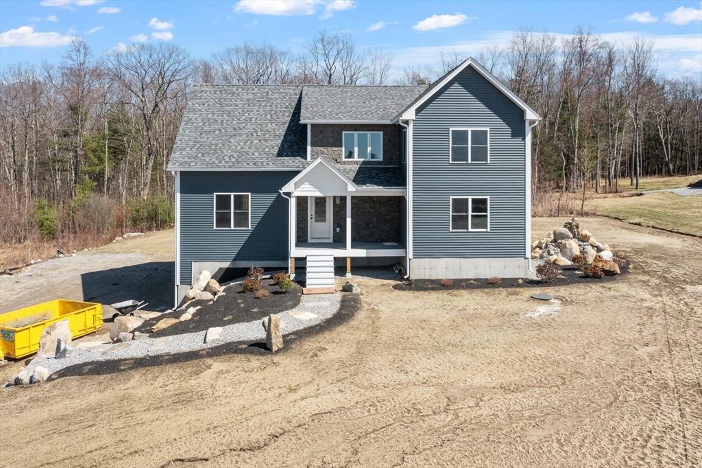 497 Ridge Road Athol, MA 01331 - Photo 8 of 38 a view of a house with backyard porch and sitting area