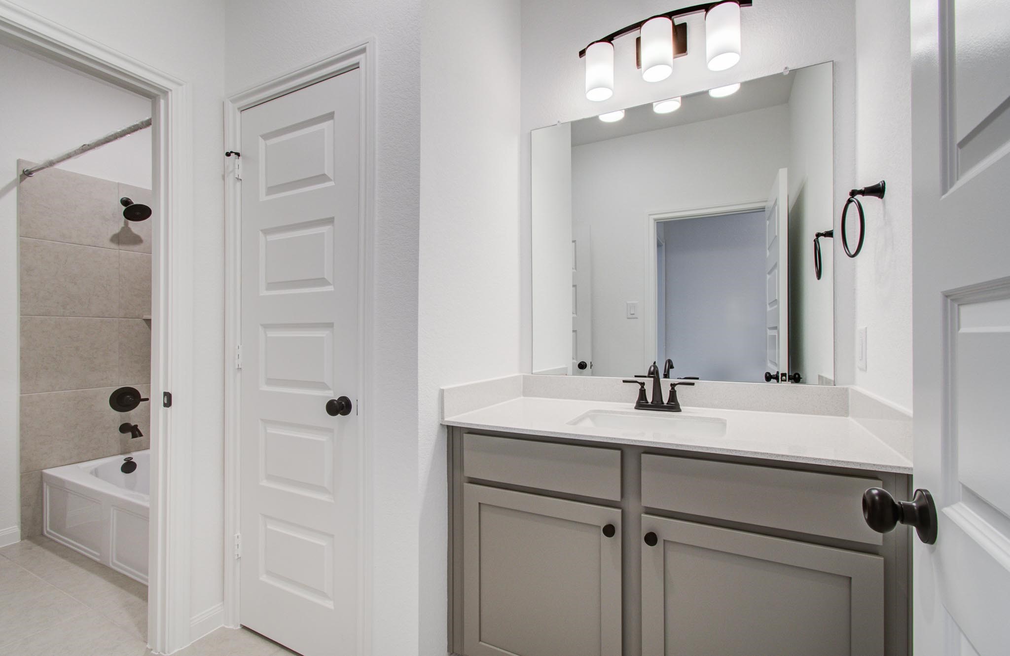 7231 Yarrow Blossom Court Katy, TX 77493 - Photo 44 of 49 a bathroom with a double vanity sink a mirror and shower