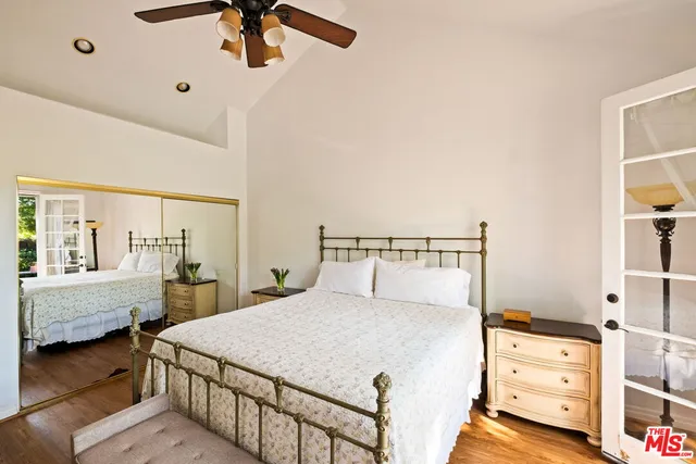 a bedroom with a bed and a cabinets