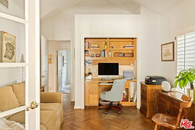 a workspace with furniture and a flat screen tv