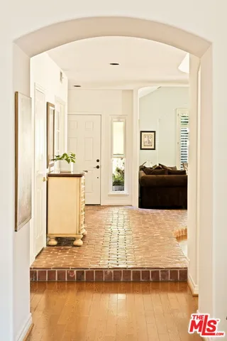 a living room with table and chairs
