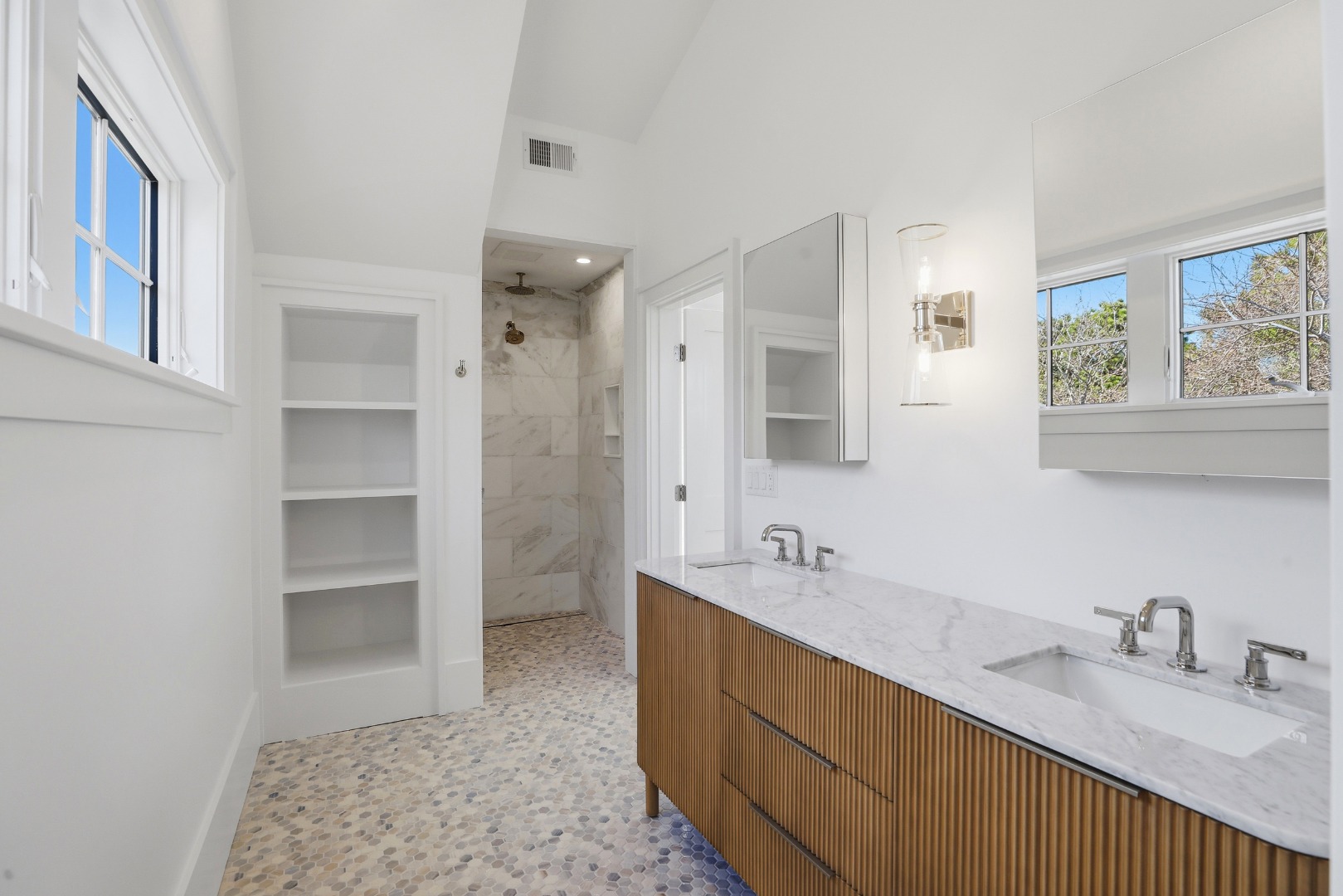 10 Rudder Lane Nantucket, MA 02554 - Photo 21 of 33 a bathroom with a double vanity sink a mirror and a bathtub