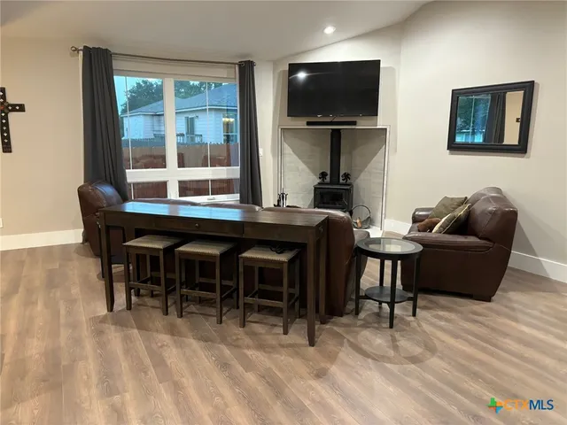 a kitchen with a dining table and chairs