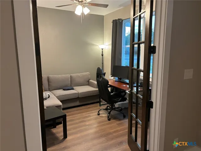 a laptop computer sitting on top of a desk