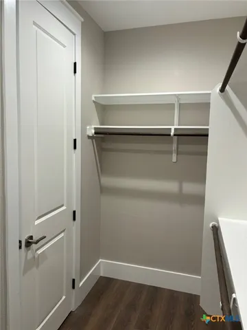 a bathroom with double vanity sinks and a mirror