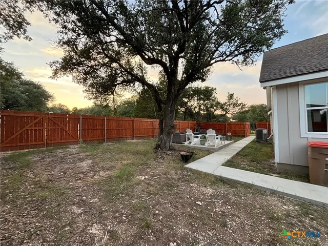 a view of a backyard with a trees