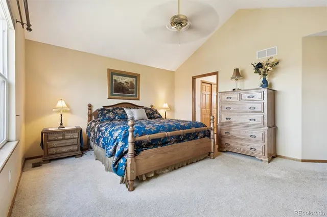 a spacious bathroom with a sink and mirror