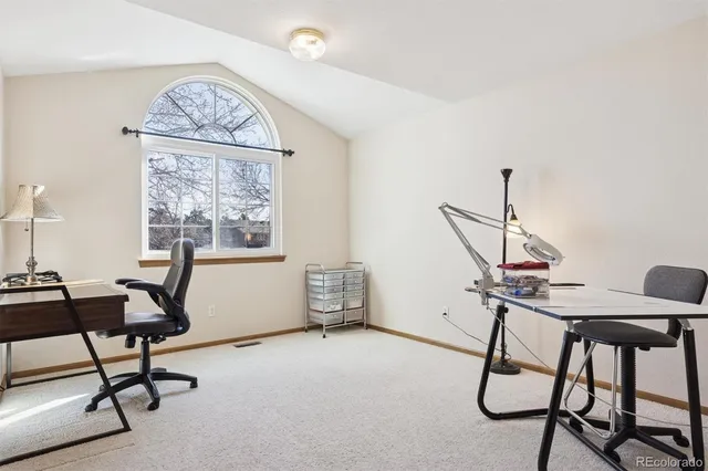 a bathroom with a granite countertop sink a mirror and a shower