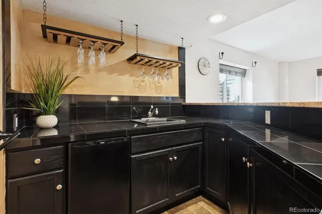 a kitchen with a table and chairs in it