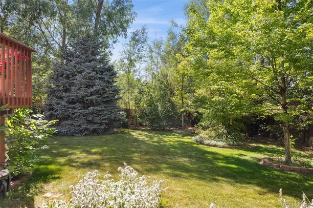 a view of a house with a yard porch and sitting area