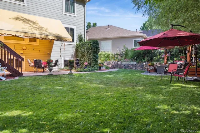 a view of a table and chairs under an umbrella
