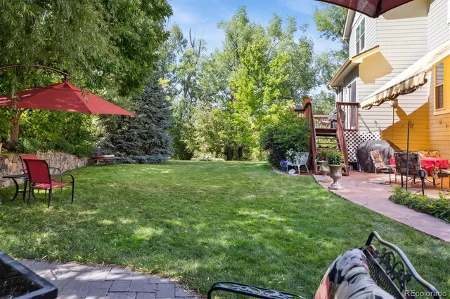 an outdoor space with furniture and umbrella