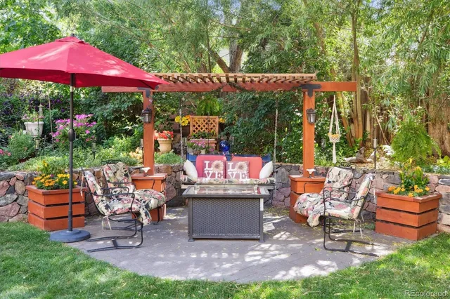 a patio with table and chairs