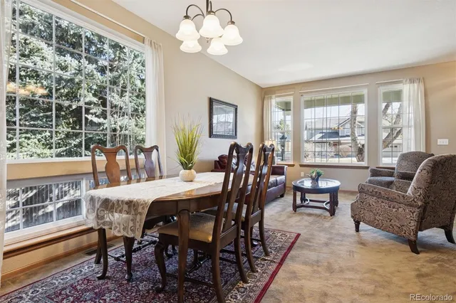 a view of a dining room with furniture window and outside view