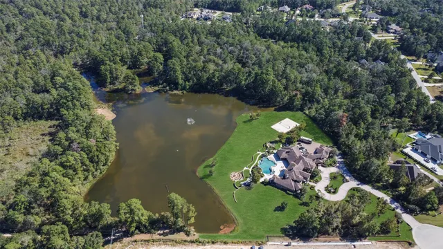 an aerial view of a golf course with parking space