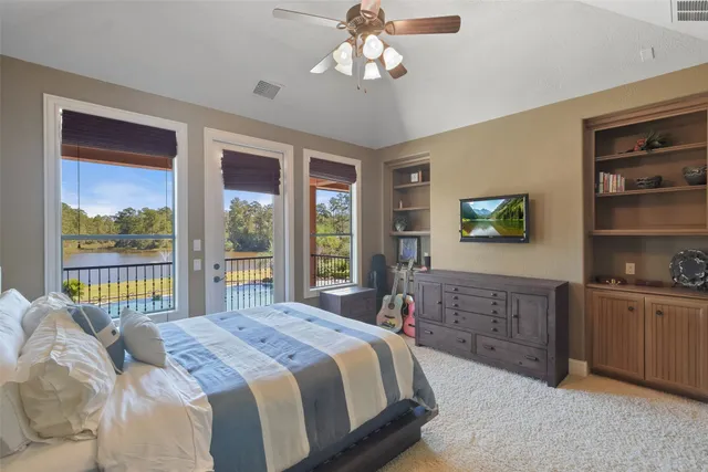a bathroom with a granite countertop double vanity sink and mirror