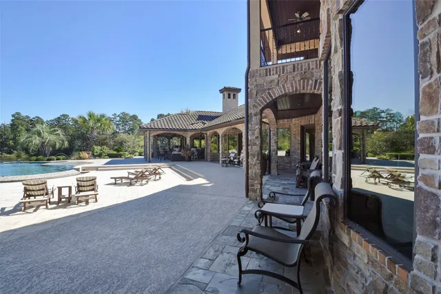 a view of a swimming pool with a yard