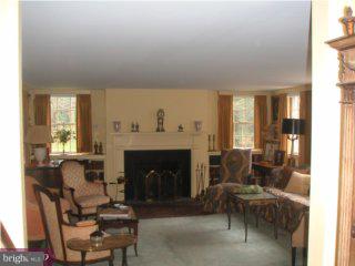 2287 South Valley Road Berwyn, PA 19312 - Photo 4 of 6 a living room with furniture and a fireplace