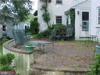 2287 South Valley Road Berwyn, PA 19312 - Photo 5 of 6 a view of a backyard with table and chairs