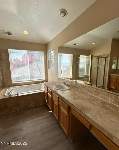a large kitchen with stainless steel appliances granite countertop a large window