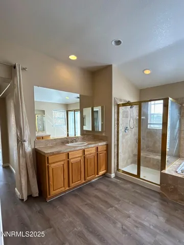 a view of a kitchen with stainless steel appliances granite countertop a refrigerator and a sink
