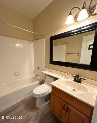 a bathroom with a sink a toilet and a bathtub