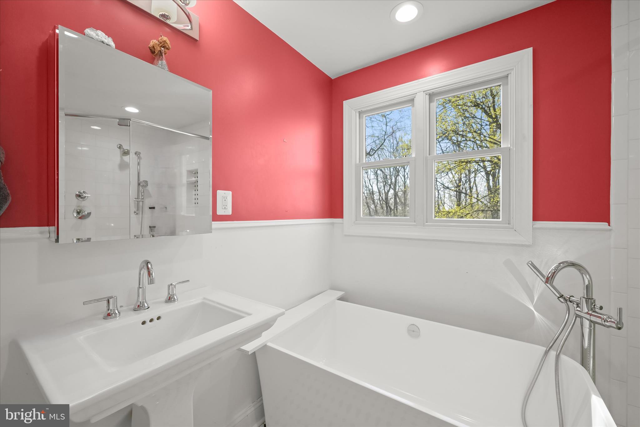 14865 Bushy Park Road Cooksville, MD 21723 - Photo 12 of 39 a bathroom with a sink and a bathtub