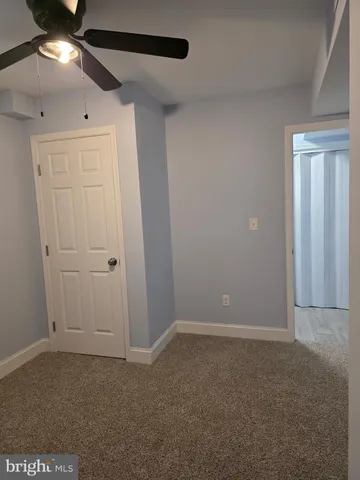 a view of a house with wooden deck front of house