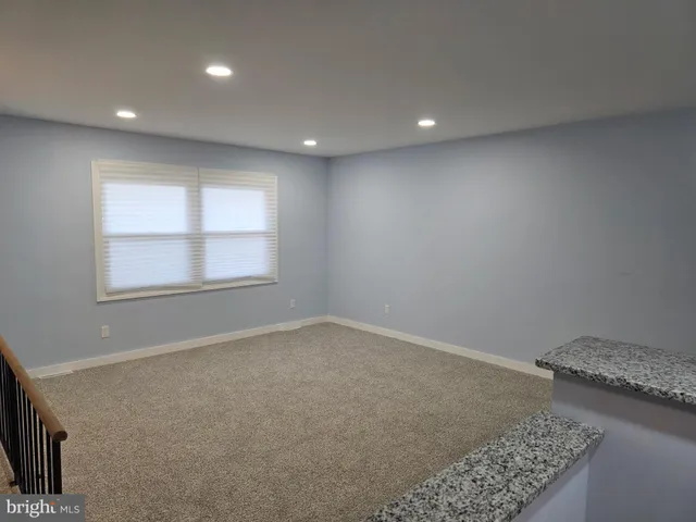 a view of a kitchen with furniture and a fireplace