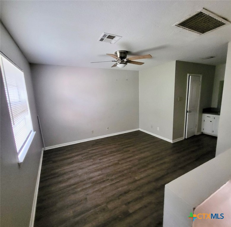131 Regency Avenue Victoria, TX 77904 - Photo 11 of 16 a view of an empty room with wooden floor and a window