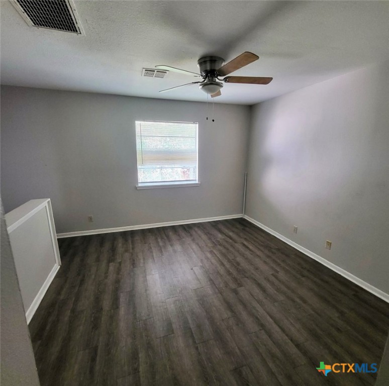 131 Regency Avenue Victoria, TX 77904 - Photo 12 of 16 a view of a room with wooden floor and fan