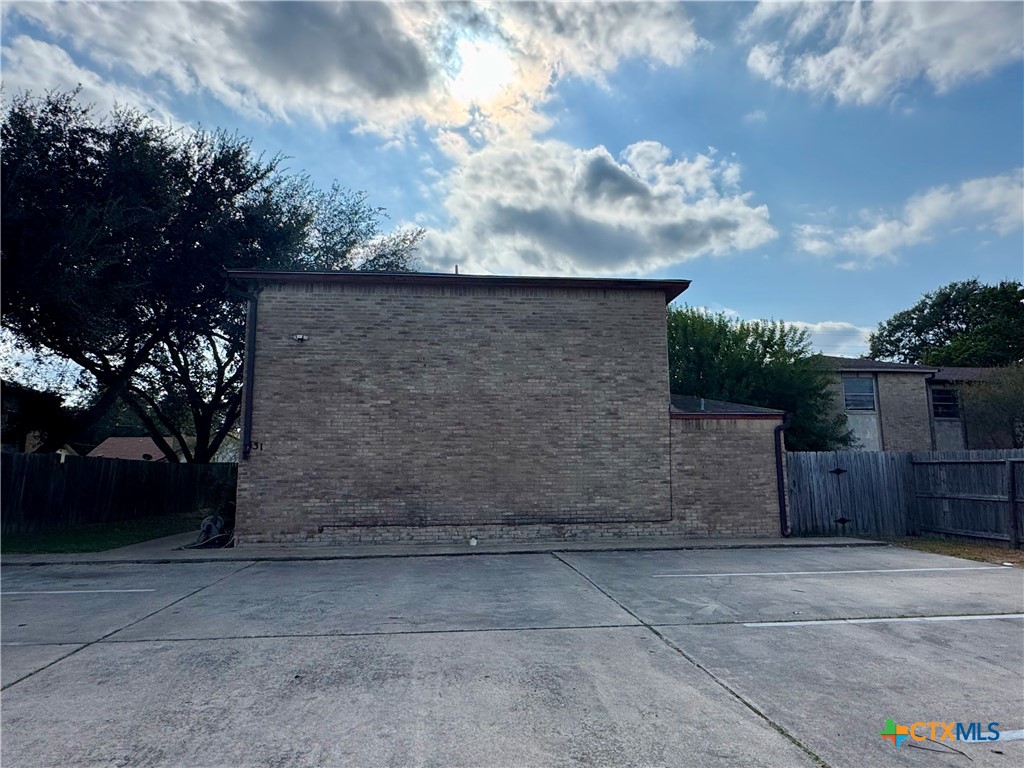 131 Regency Avenue Victoria, TX 77904 - Photo 4 of 16 a brick building with a yard