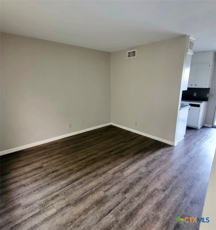 131 Regency Avenue Victoria, TX 77904 - Photo 8 of 16 a view of an empty room and wooden floor