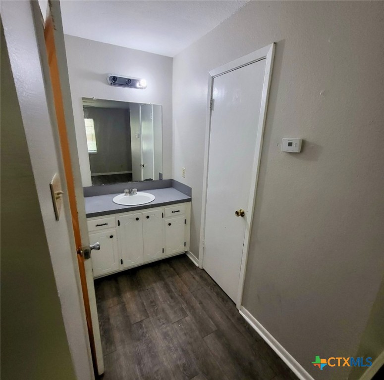 131 Regency Avenue Victoria, TX 77904 - Photo 10 of 16 a bathroom with a granite countertop sink and a mirror