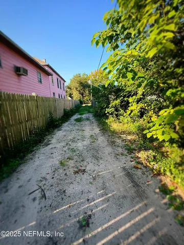a backyard of a house with lots of green space