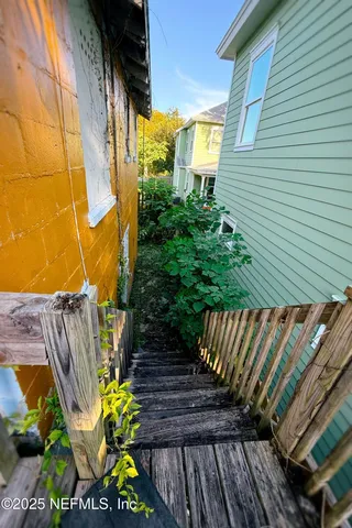 a view of a backyard with sitting area