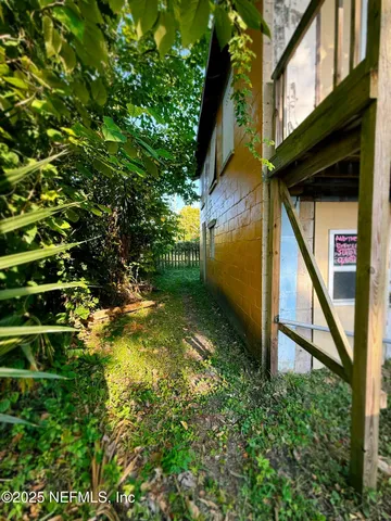a backyard of a house with lots of green space