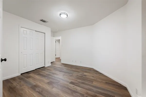 a view of a livingroom with furniture window and wooden floor