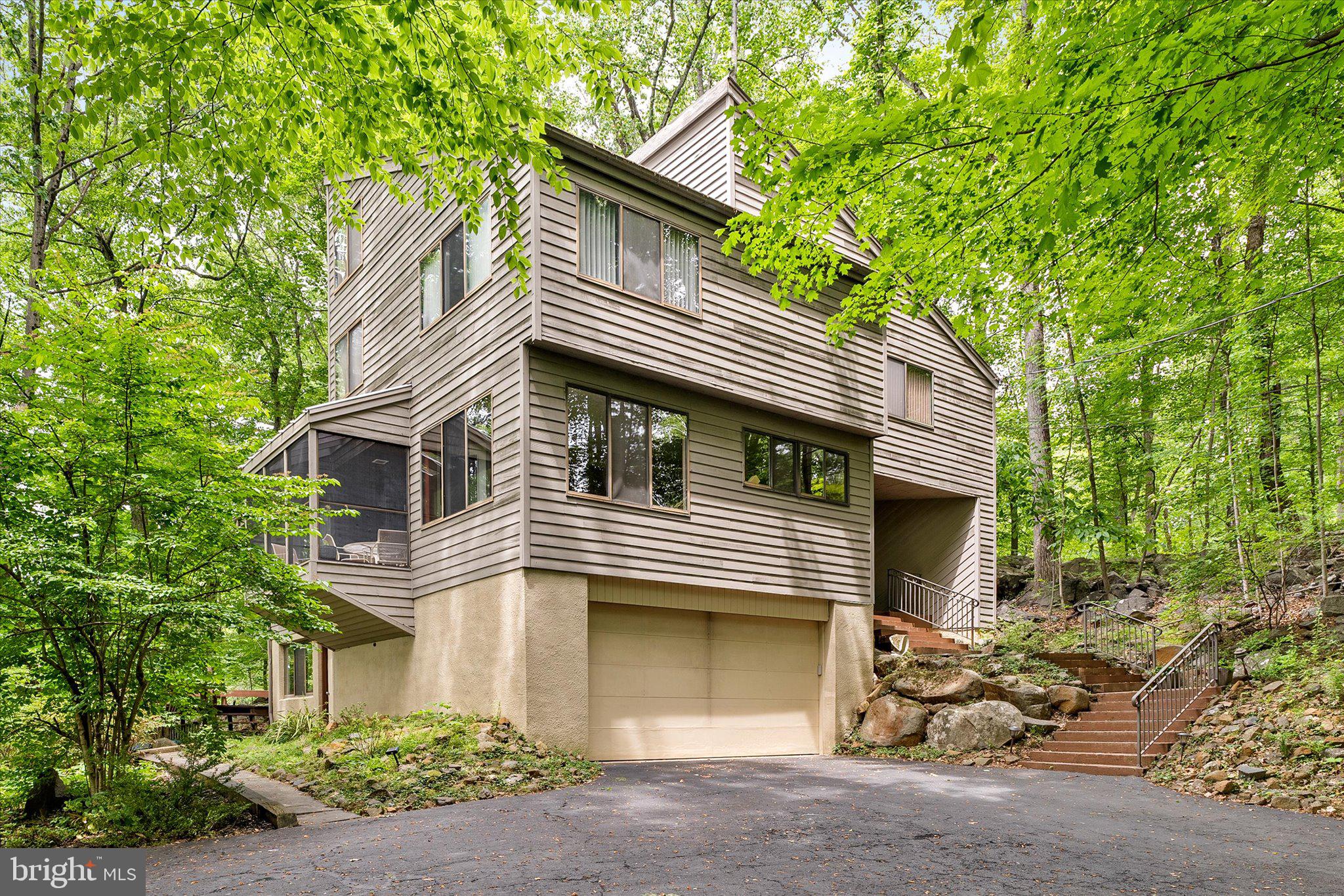 1163 Stuart Road Princeton, NJ 08540 - Photo 1 of 32 a front view of a house with a garage