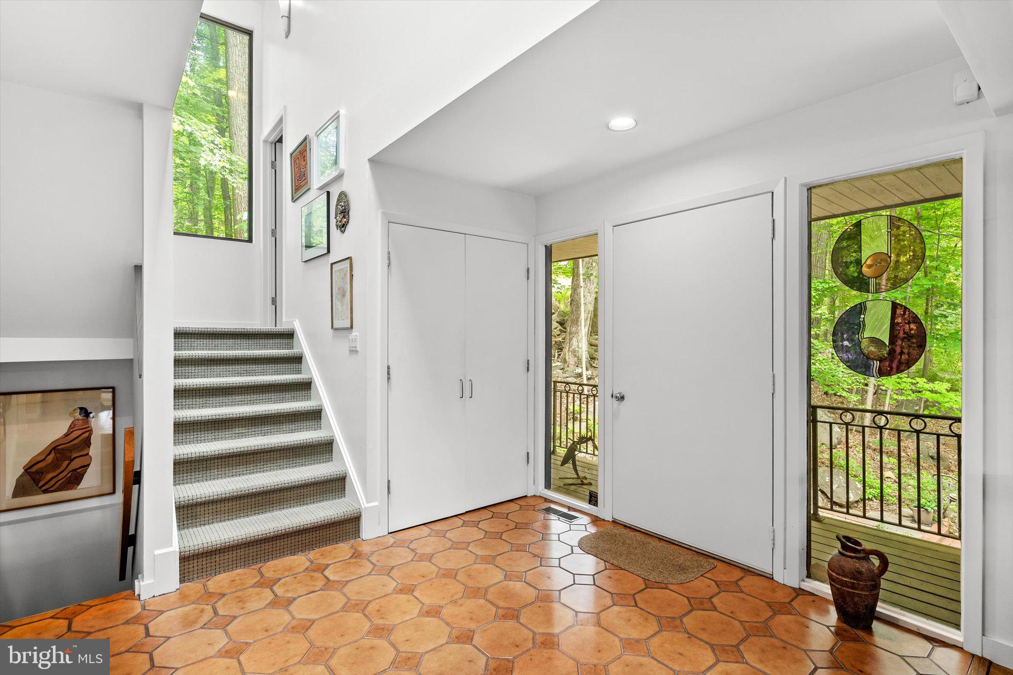 1163 Stuart Road Princeton, NJ 08540 - Photo 3 of 32 a view of a bedroom with wooden floor and windows