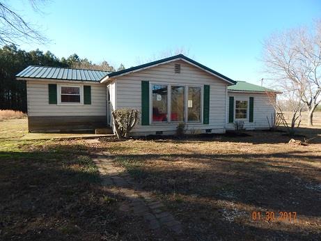 497 Revilo Road Leoma, TN 38468 - Photo 1 of 10 a front view of a house with garden
