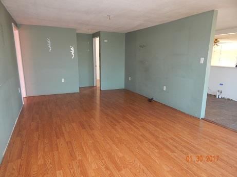 497 Revilo Road Leoma, TN 38468 - Photo 4 of 10 a view of an empty room and wooden floor
