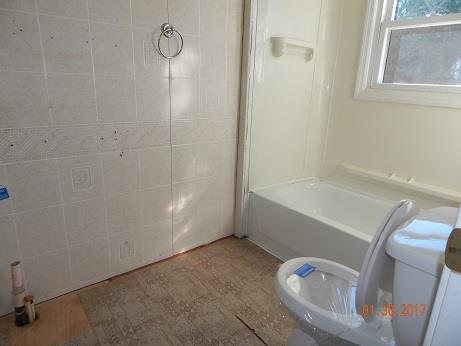 497 Revilo Road Leoma, TN 38468 - Photo 5 of 10 a bathroom with a tub and a window