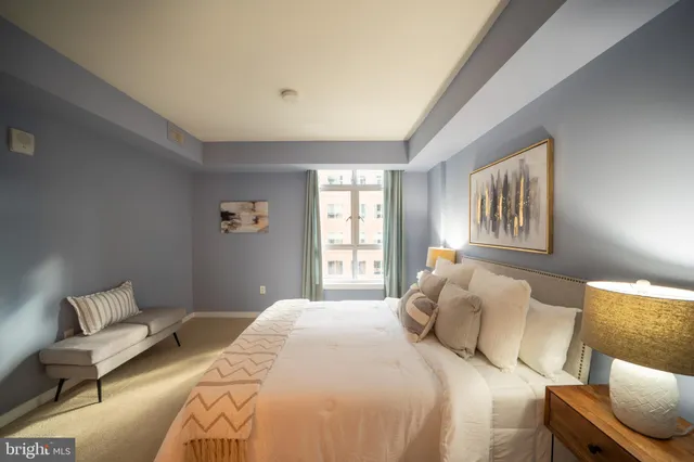 a bedroom with a bed and a couch