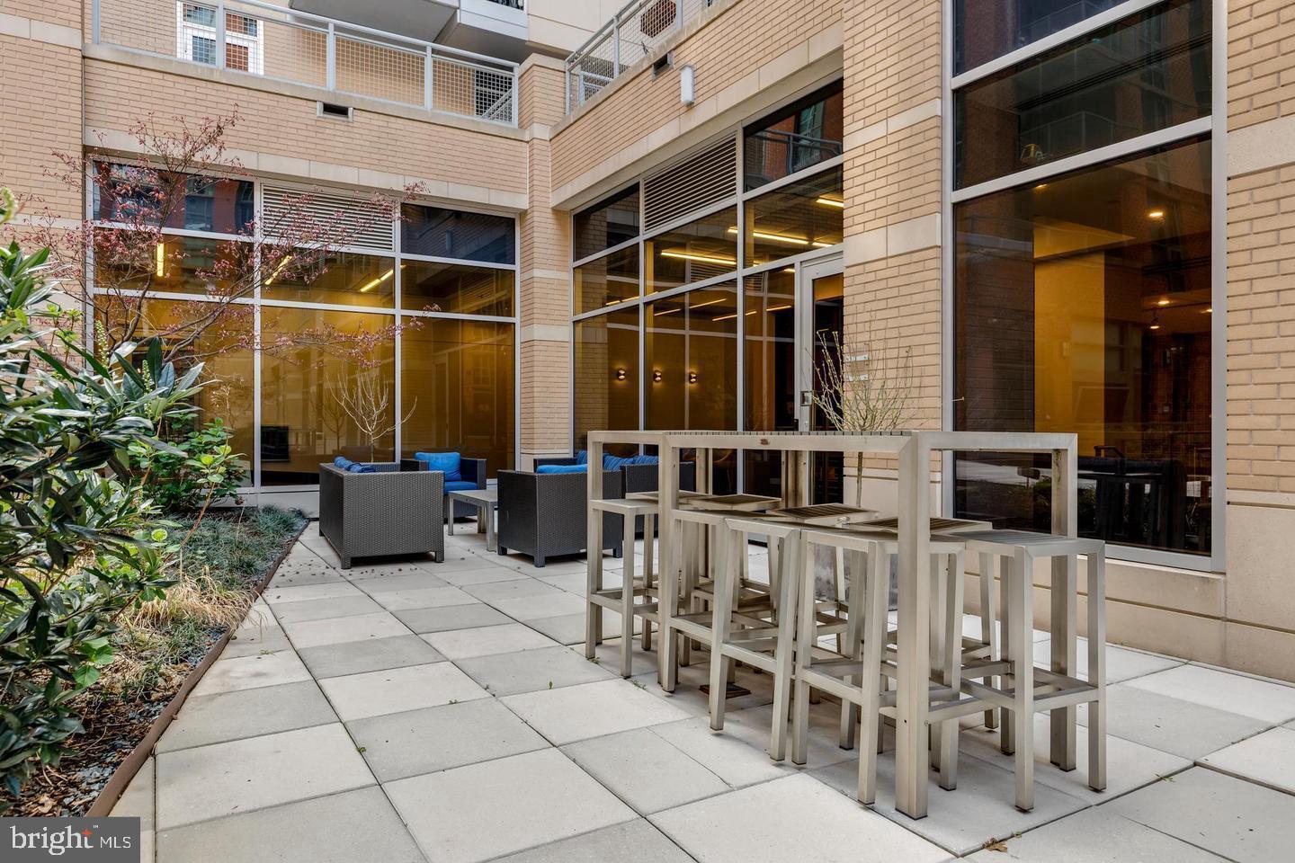 1025 First Street Southeast, Unit 611 Washington, DC 20003 - Photo 22 of 36 a view of a patio with table and chairs