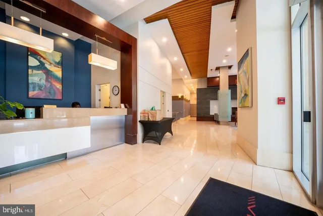 a front view of a building with potted plants