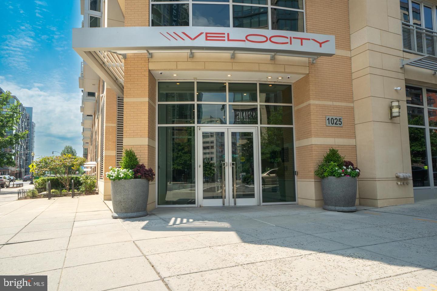 1025 First Street Southeast, Unit 611 Washington, DC 20003 - Photo 33 of 36 a front view of a building with potted plants