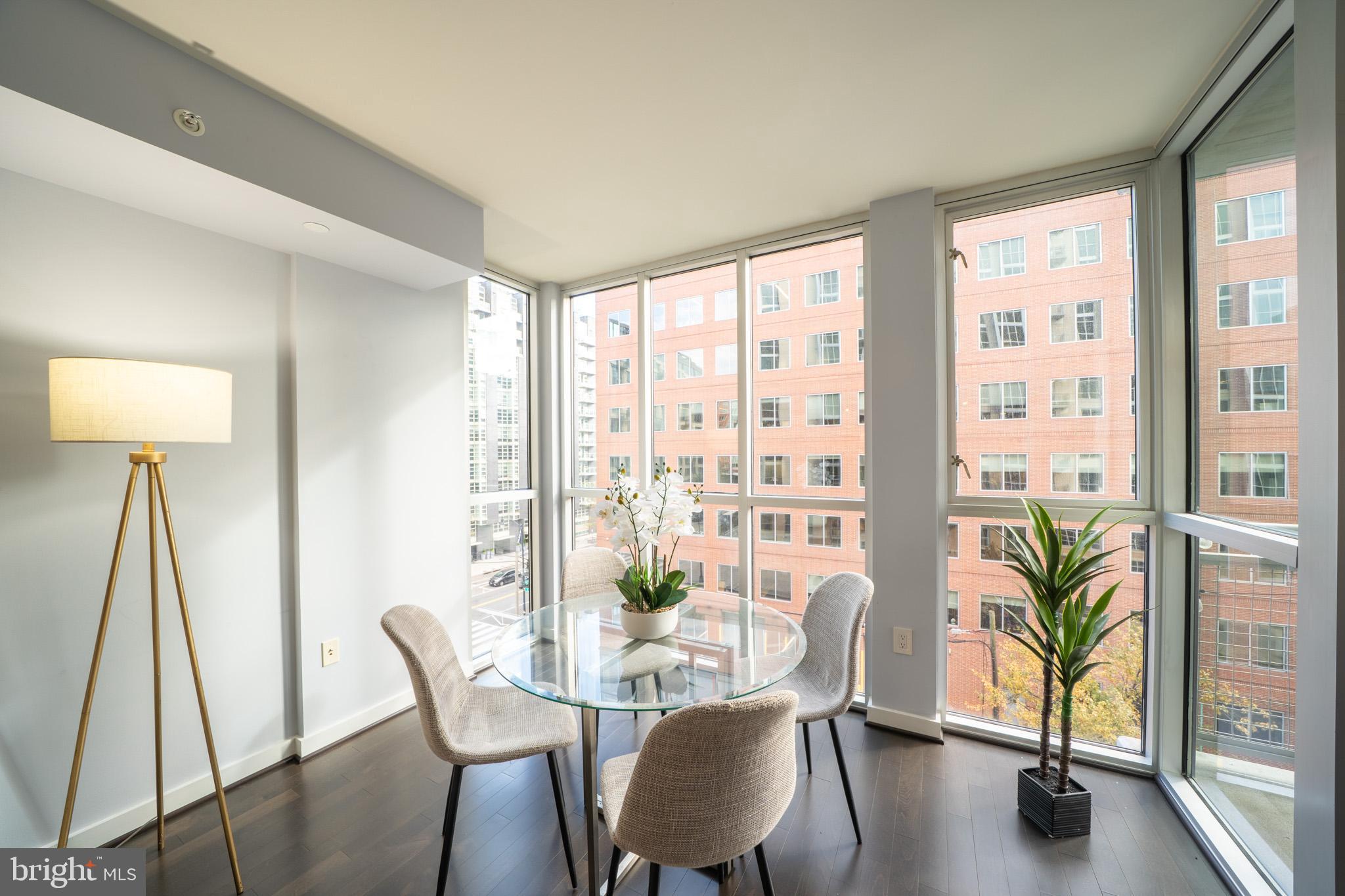 1025 First Street Southeast, Unit 611 Washington, DC 20003 - Photo 8 of 36 a view of a dining room with furniture window and wooden floor
