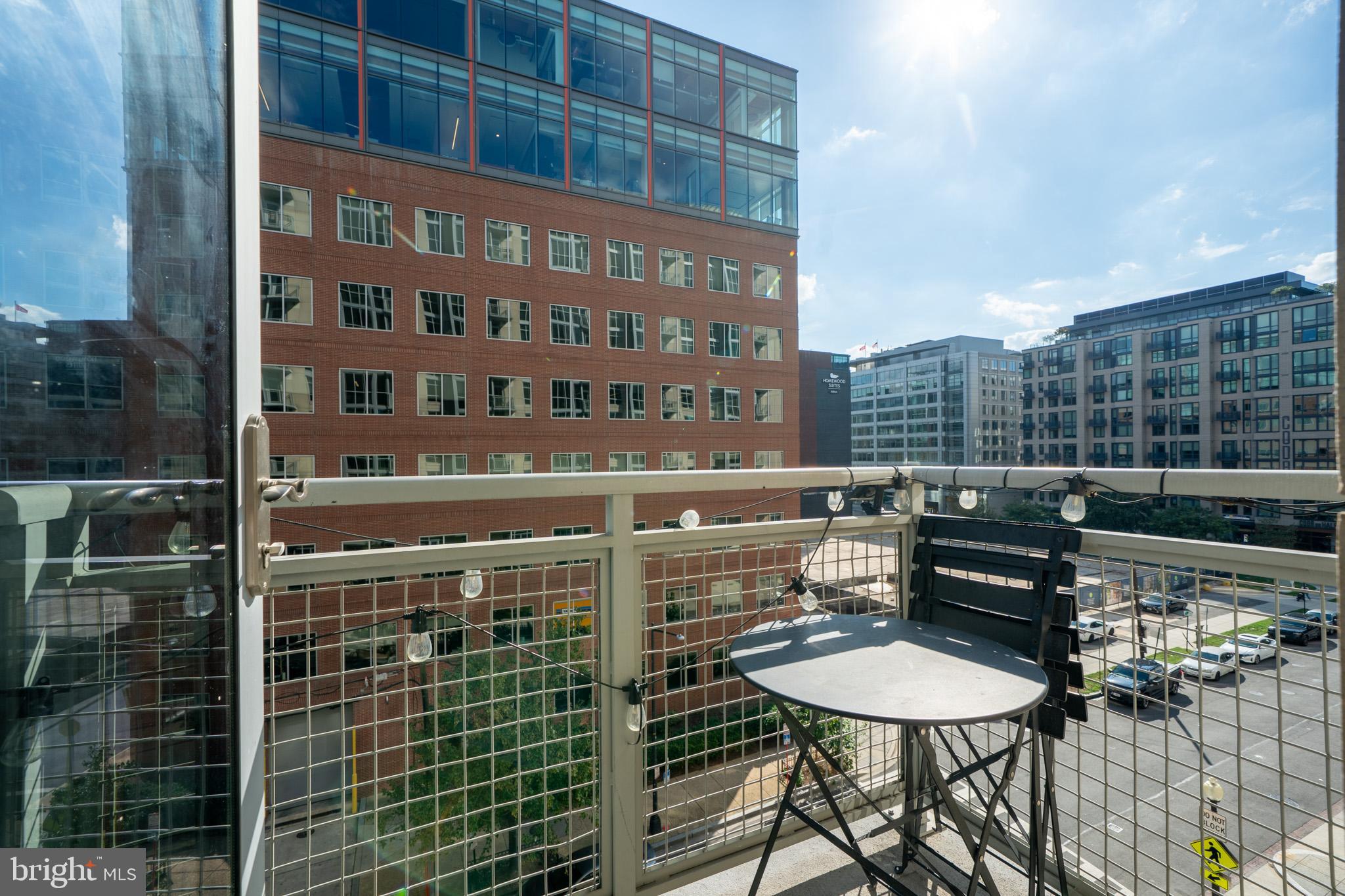 1025 First Street Southeast, Unit 611 Washington, DC 20003 - Photo 10 of 36 a terrace with a table and chairs