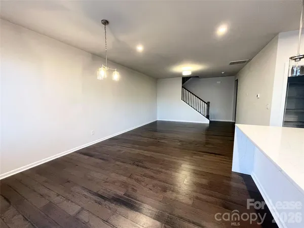 a view of a hallway with an empty room
